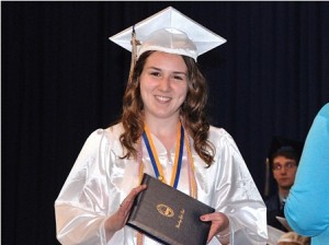 Julia Imbalzano happily receives her diploma.