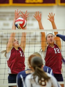 Westborough High School's Sarah Anderson (#17, left) blocks this shot by Notre Dame Academy's Julia Marshall as Anderson's teammate Samantha Kehoe assists.