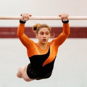 Marlborough High School's Abbie McNickol begins her routine on the bar.  McNickol scored a 6.5 to lead her team.