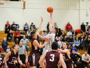 Marlborough High School's Mike Villodas puts the ball up and over. 