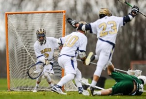Shrewsbury High School goalie JT Rather makes a save on the shot by Grafton High School's Mike Najemy (on ground).