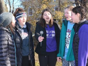 Prior to the 5K road race, vocalists of the Westborough High School a capella group known as Double Take sing “The Star-Spangled Banner.”
