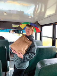 School nurses deliver school lunches by bus