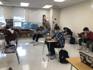  Westborough High School students working at their desks in a socially distanced classroom. 