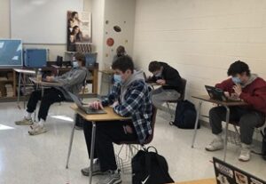 Westborough High School students working at their desks in a socially distanced classroom.