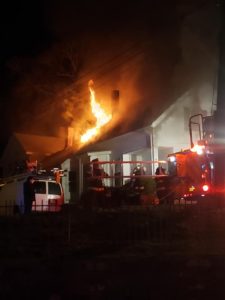 Midnight blaze injures firefighter, damages home