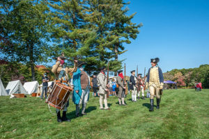 Reenactors perform at a past encampment similar to a “Military Through the Ages” event currently scheduled for Aug. 7 and 8. 