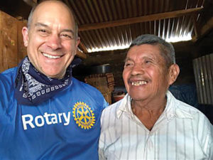 Rotarian and former District Governor Steve Sagar with a stove recipient.