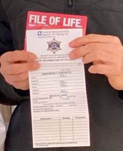 Worcester County Sheriff Lewis Evangelidis displaying a File of Life