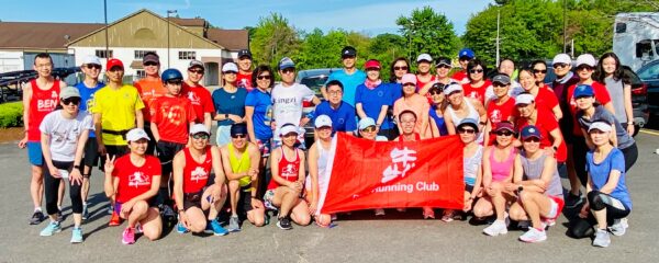 Connie Cao and son Enchee Xu stand (6th and 7th from left) with the BEN Running Club.