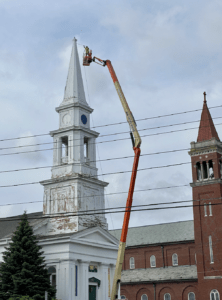 Crews repaint Westborough’s Unitarian Universalist church