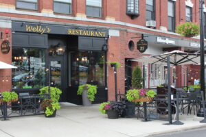Welly's has an outdoor dining area in front of its restaurant in Hudson.  Photo/Laura Hayes