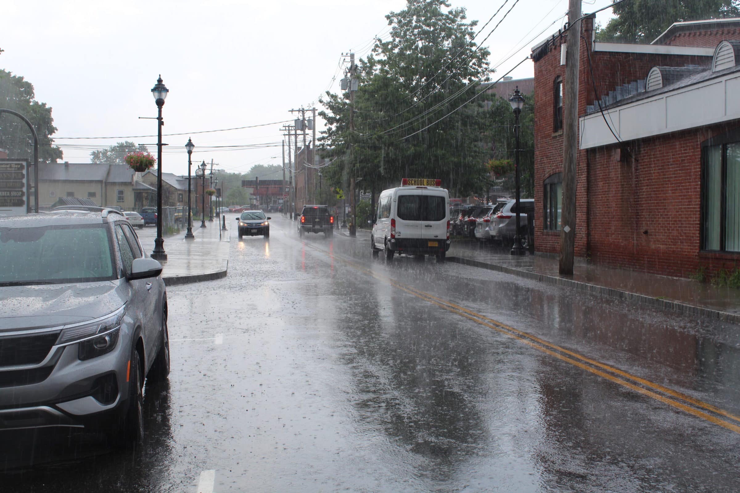 Cars drive in the rain on South Street in Hudson. Photo/Laura Hayes