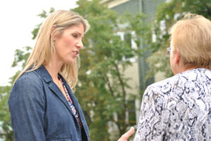 US Representative Lori Trahan at the Marlborough Community Cupboard speaks with Community Cupboard Director Barbara LaGrenade. 