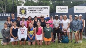 Women's group players gather for a group photo during this year’s Fourth Annual Charity Tennis Tournament at Westborough High School.