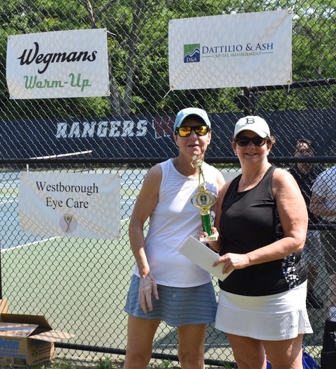 Lions Club member and Tennis Tournament Co-Chair Sue Ash stands with Women’s Division winner Emily Karlin.