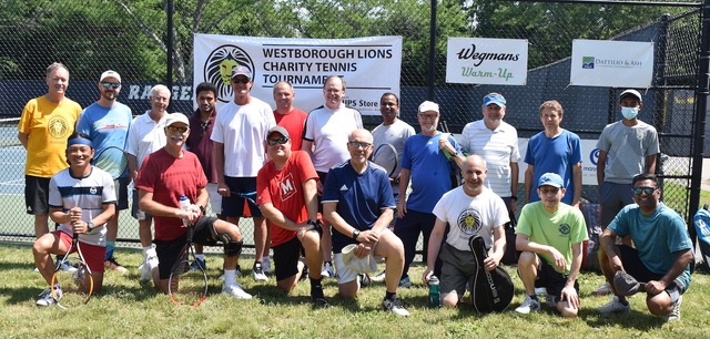 Men's group players gather for a group photo during this year’s Fourth Annual Charity Tennis Tournament at Westborough High School.