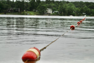 Buoys float marking the swimming area at Hudson’s Centennial Beach that is supervised by lifeguards. 