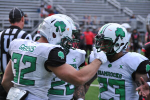 Zach Grasis celebrates with teammates after scoring in the first quarter of his team’s game against the Connecticut Panthers.
