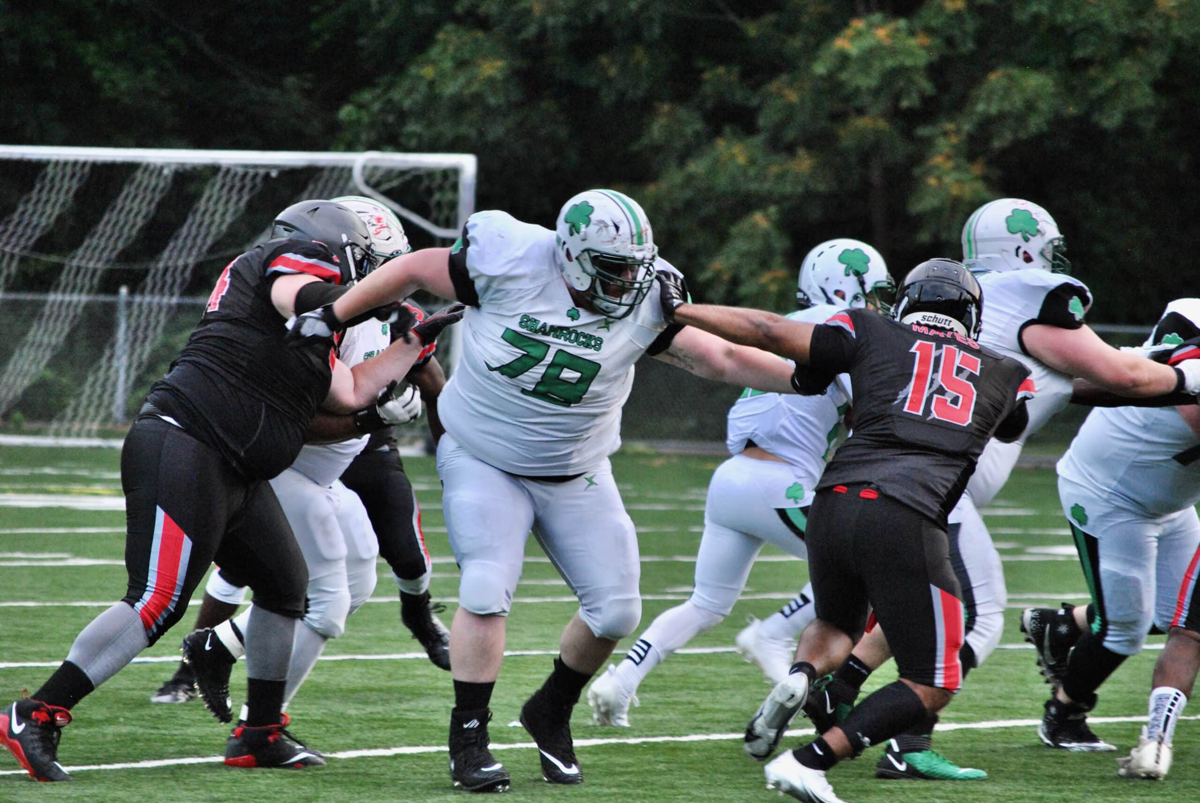 Offensive lineman Michael Hurst stretches to hold back a Connecticut opponent.