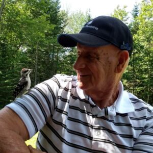 Terry Paladino reached out to the Community Advocate and shared a photo of her husband, Jim, smiling at the small woodpecker perched on his shoulder.
