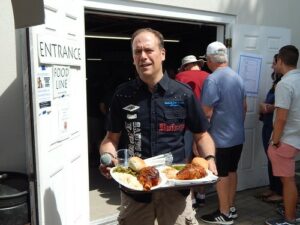 George ‘Regas’ Regan will play music all day during this year’s three-day 2021 Greek Festival at the Sts. Anargyroi Greek Church. In a 2019 photo, Regan, Marlborough’s well-known disc jockey, takes a break and gets some lamb shank dinners.