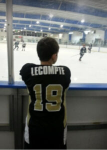 Daniel LeCompte watches a game through the glass in Georgia.   Photos/Courtesy Stacie LeCompte