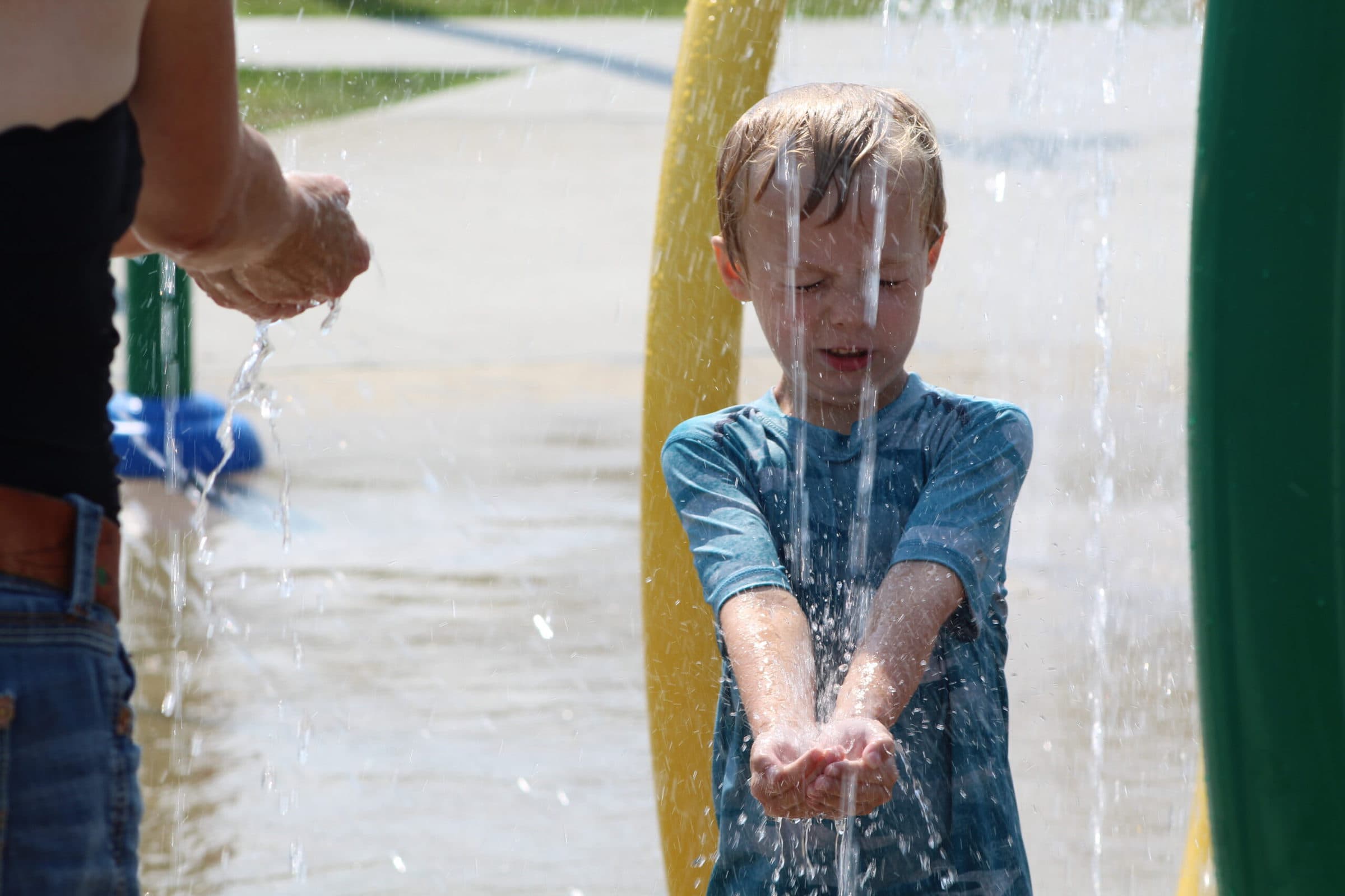 Ollie Robinson enjoys the water in the splash pad.