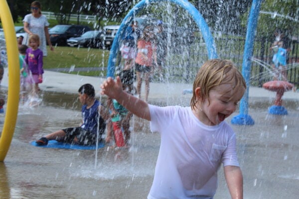 Egan plays in the water in the Ghiloni Park splash pad.