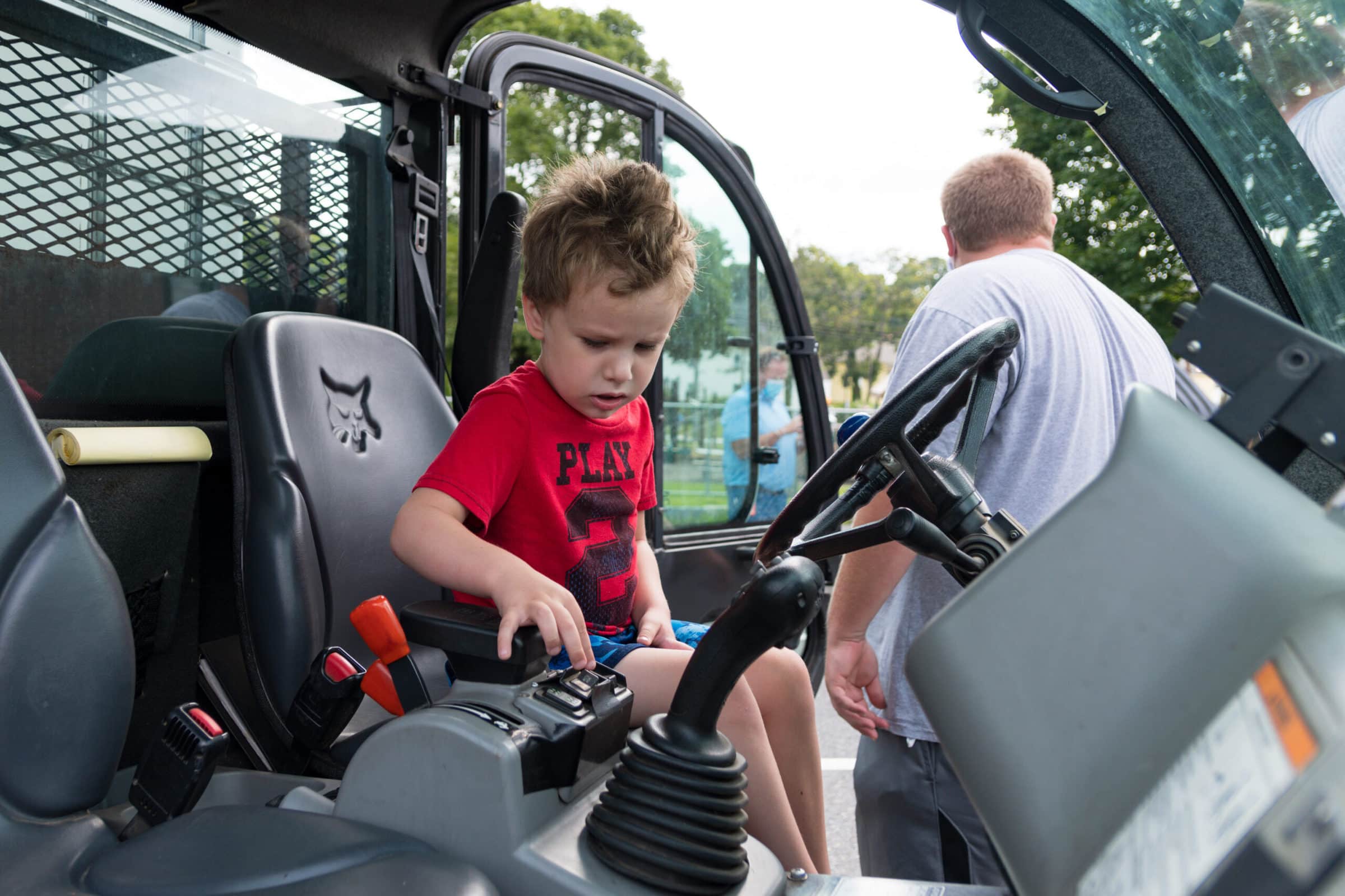 A child explores the cab of a Marlborough DPW vehicle during a ‘touch-a-truck’ event, July 29. (Photo/Jesse Kucewicz)