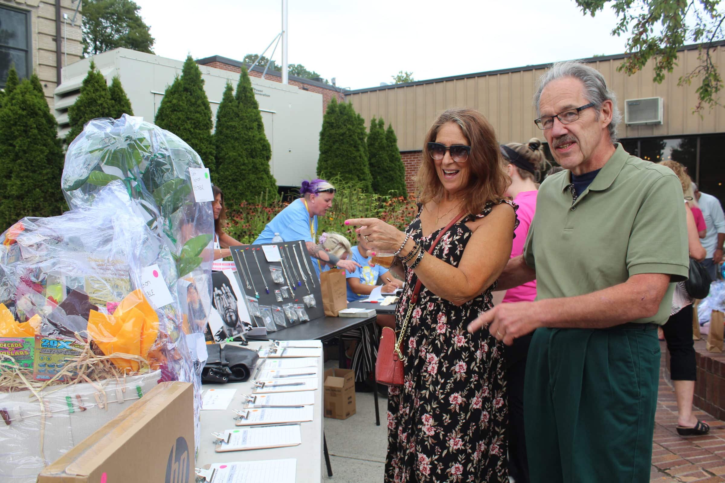 Ralph and Janet Belmore check out the raffle items.