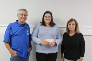  Ward Park Pickleball Club’s Dennis Pollard and Joanne Avey present a check to the Boys & Girls Club of Metrowest’s Laura Terzigni.   Photo/Laura Hayes