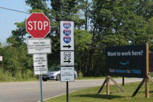Signs at the entrance to the Amazon facility on Bartlett Street in Northborough tell drivers which way to turn.