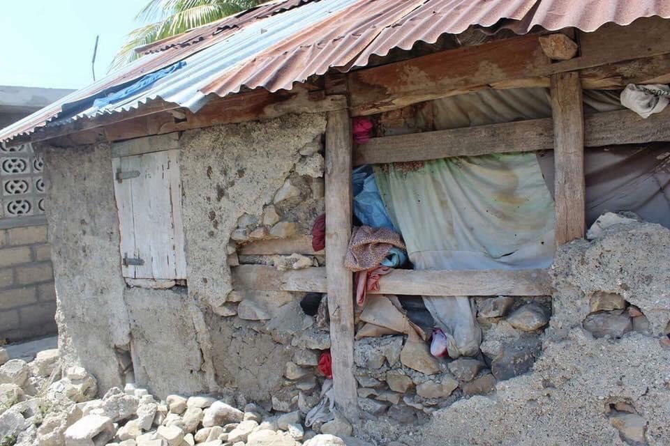 Though the 2010 earthquake devastated homes, many Haitian people made do, using paper or clothing to keep water out.