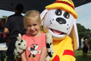 Amalia Mulcahy was excited to see Sparky the Fire Dog during National Night Out. 