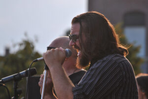 Andy Coyle of the Midtown Horns sings during a performance in Westborough.  (Photo/Dakota Antelman)
