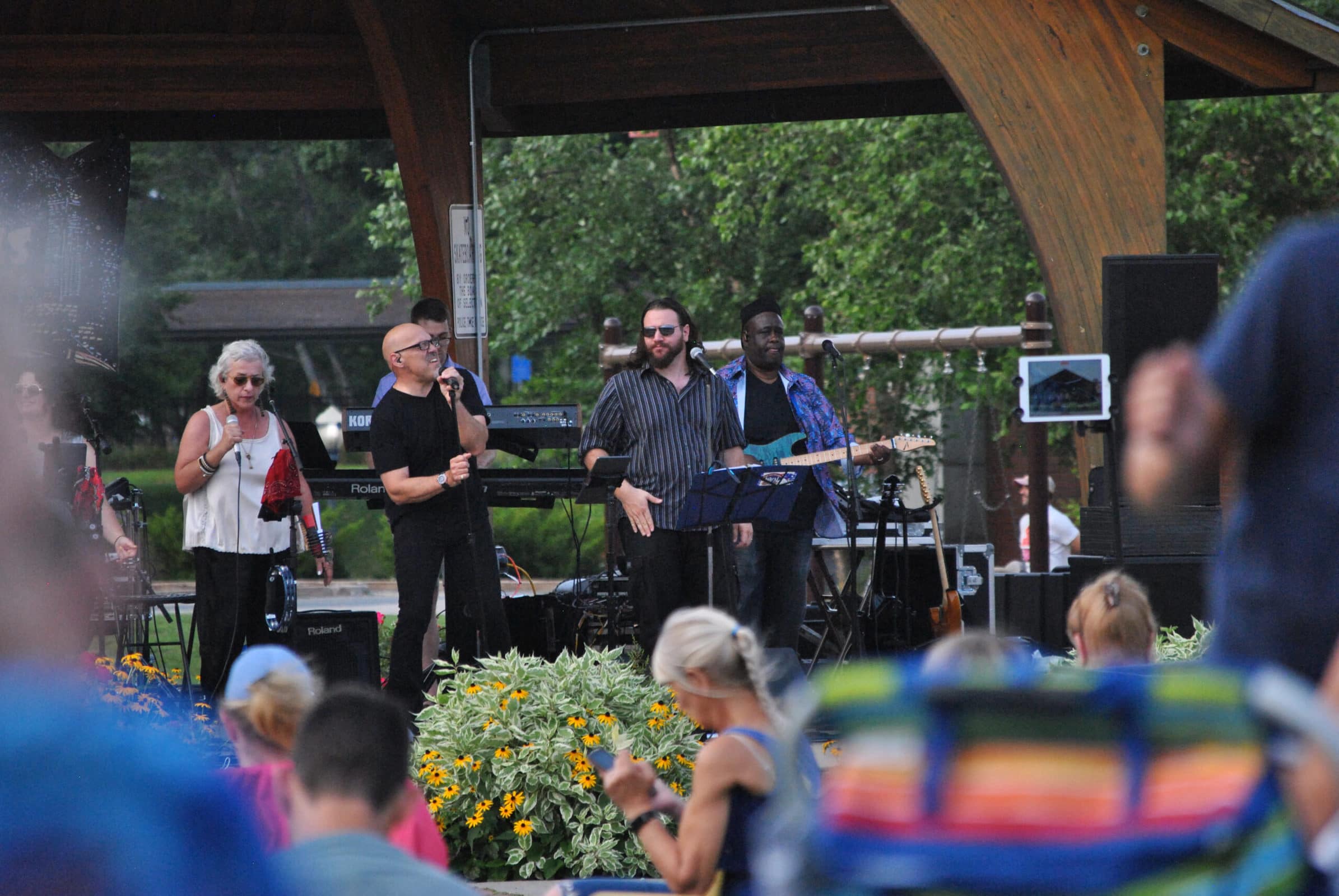 Concert attendees enjoy a performance of the Midtown Horns as part of Westborough’s Summer Concert Series on Aug. 10.