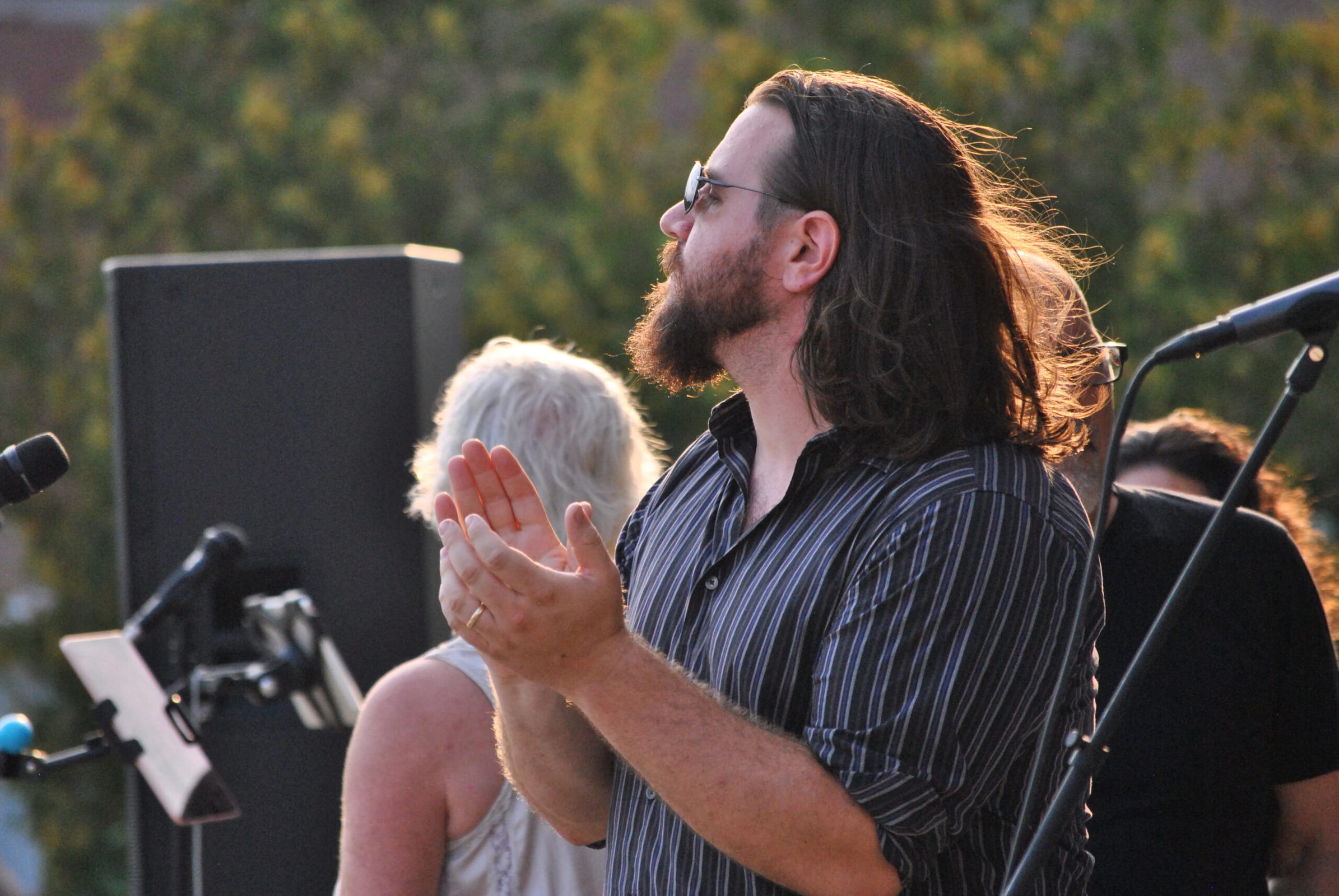 Andy Coyle claps during his band’s performance.
