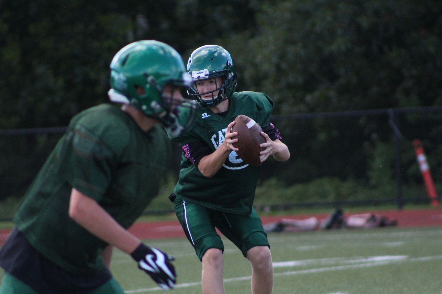 A Grafton quarterback looks before throwing the ball. (Photo/Laura Hayes)