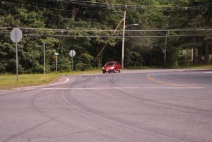 A car passes through the intersection of Cox Street, Old Bolton Road, and Old Stow Road in Hudson.   Photo/Dakota Antelman