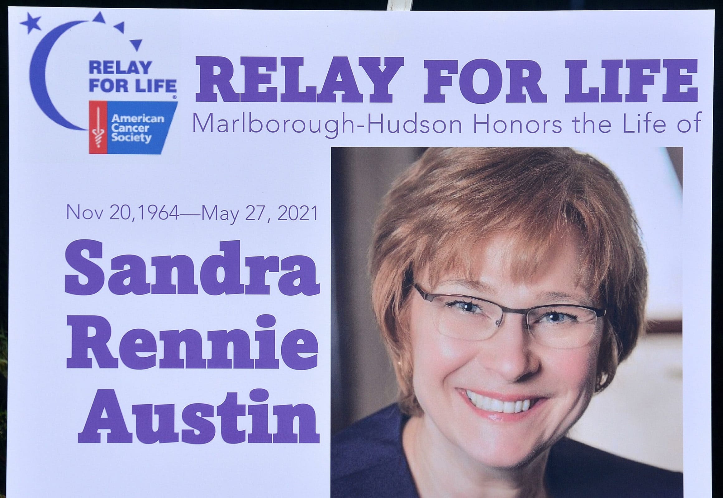The life of Sandra Rennie Austin is honored with posters on the track at Ward Park.