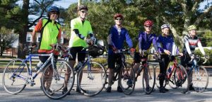 Roger Peduzzi (third from right) stands with fellow riders rides in a past bike ride to raise money for people with HIV or AIDS who need help taking care of their pets.   Photo/courtesy Phinney’s Friends