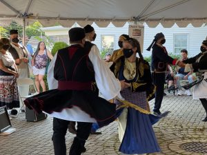 Folk dancers perform under one of the temporary tents set up for this year’s Greek Festival at the Sts. Anargyroi Greek Orthodox Church in Marlborough. 