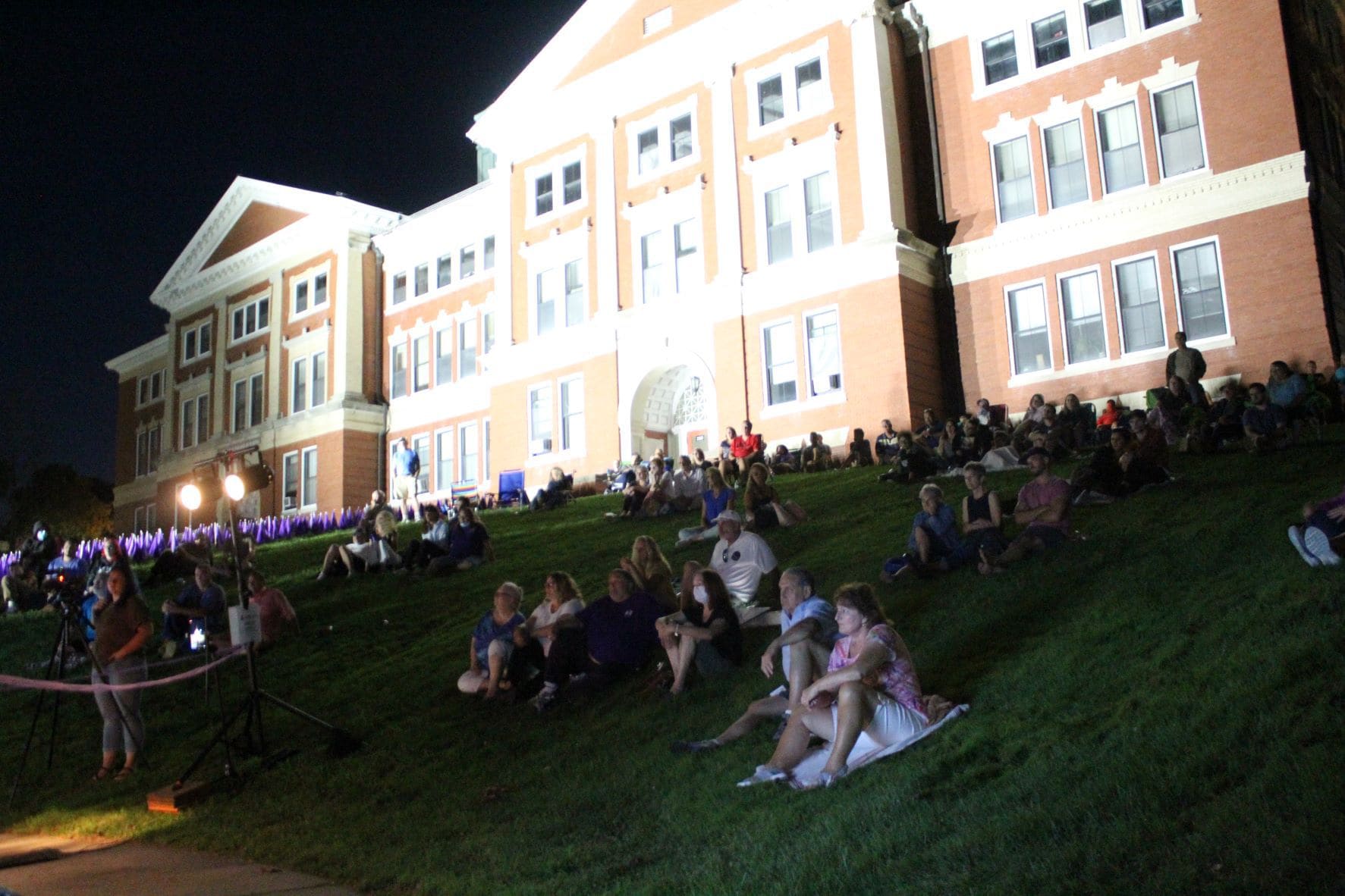 People gather on the lawn of the Walker Building. (Photo/Laura Hayes)