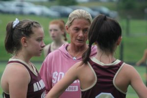New Algonquin Field Hockey coach Jennifer Brown speaks to players during a recent game against Marlborough.