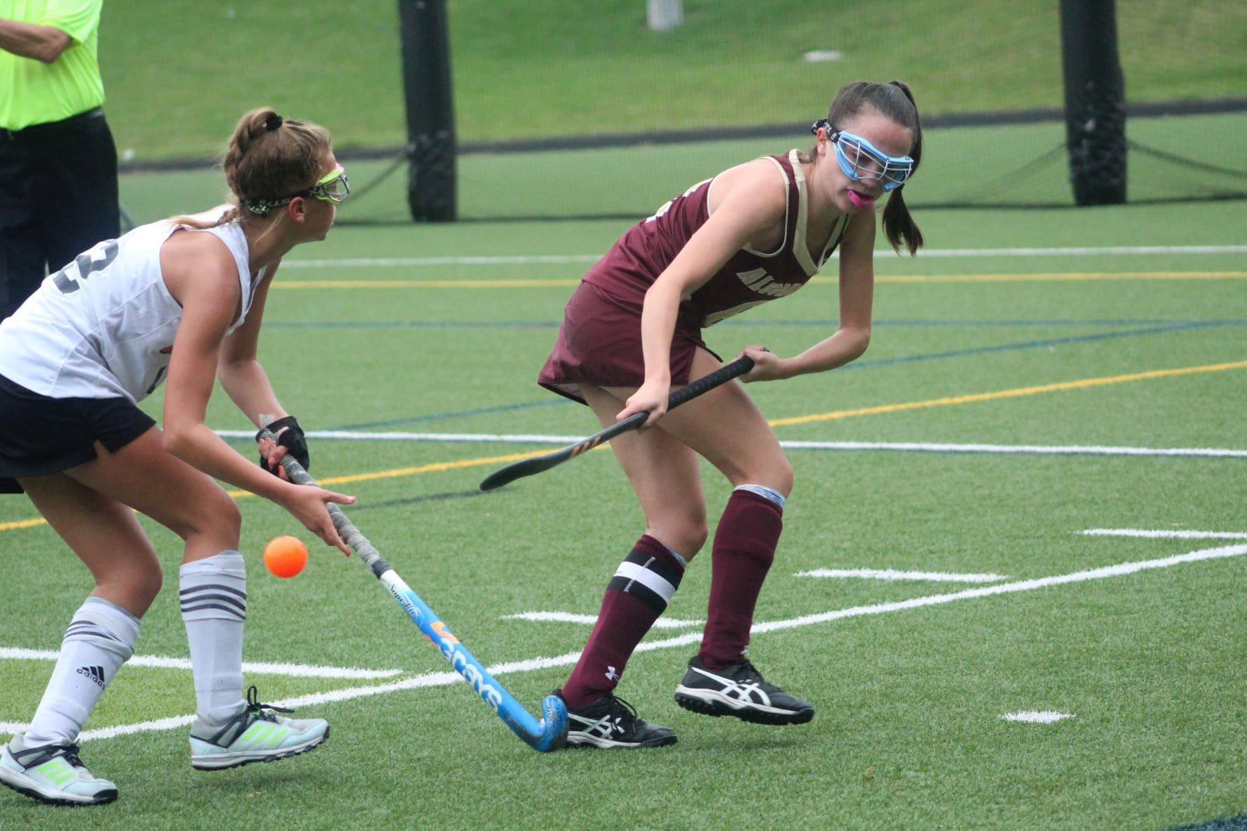 An Algonquin player reaches back to corral a ball away from a Marlborough player, last week.