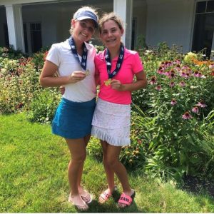  Addison Cutting stands with her sister and fellow golfer, Olivia.