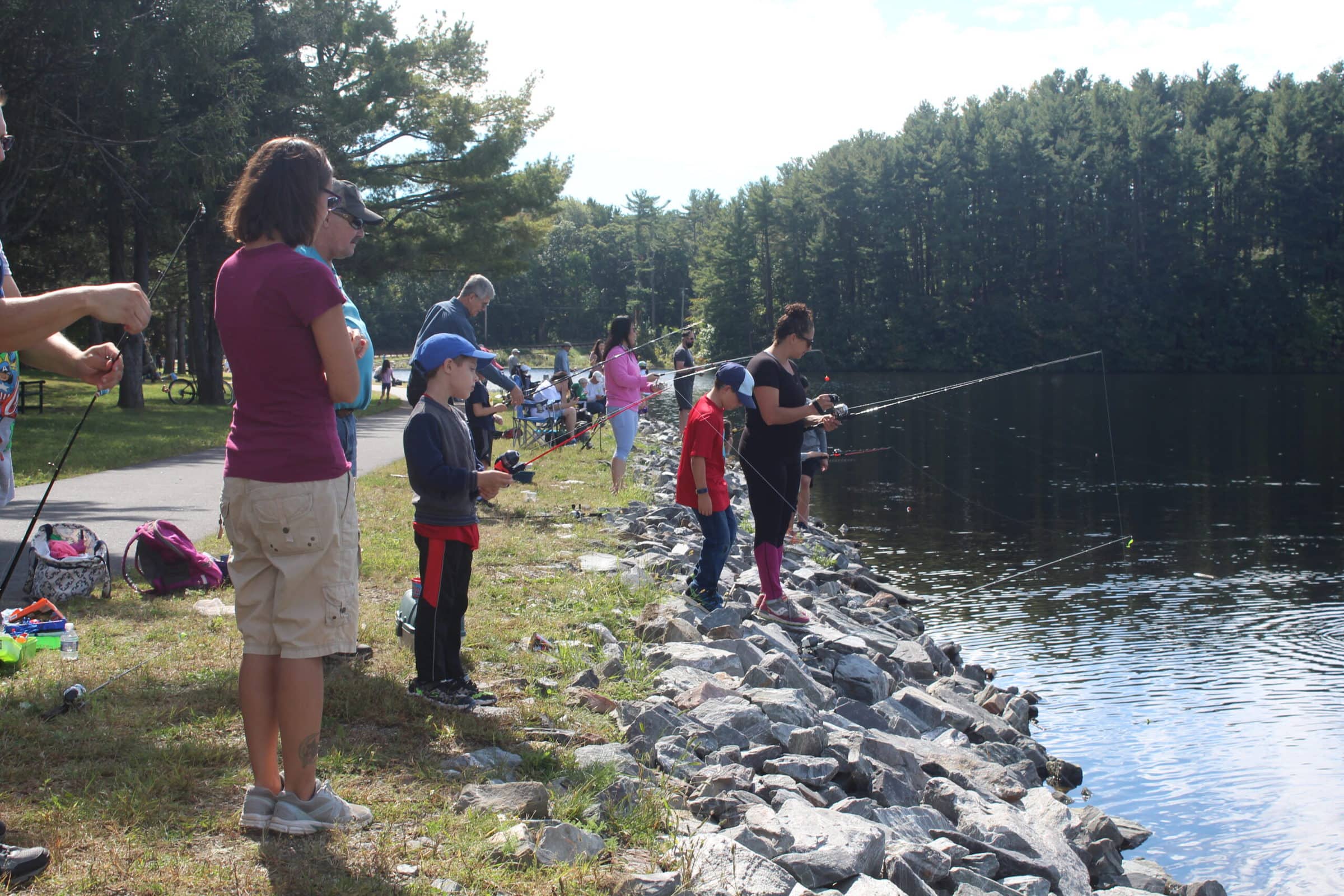 Anglers gather on the banks of Sandra Pond.