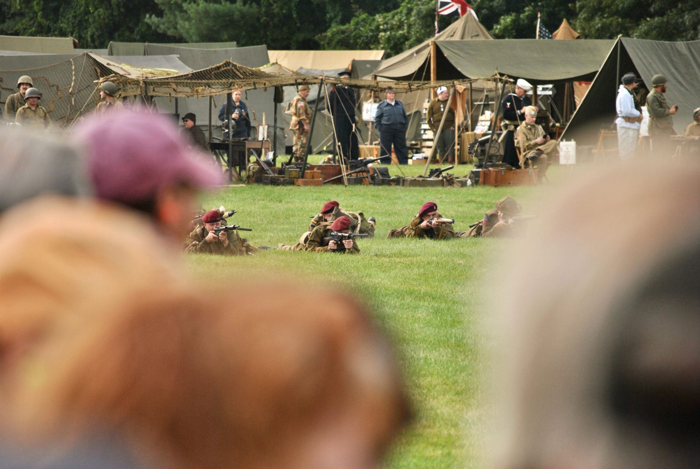 Reenactors take their positions during this year’s Battle for the Airfield reenactment at the American Heritage Museum in Hudson.