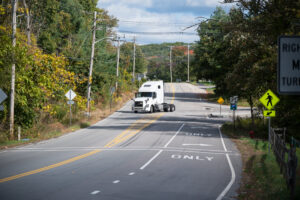 Trucks pass along Bartlett St. in Northborough. The Northborough Planning Board is weighing next steps on warehouse moratorium. Photos/Jesse Kucewicz